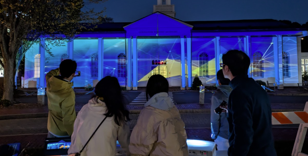 Youth Steam Initiative members setting up projection mapping equipment